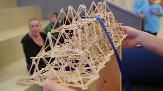 Physics students break toothpick bridges at Showcase