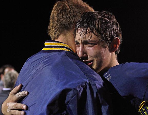 During senior night senior Cameron Calhoun has an emotional moment at the end of his last high school football game.