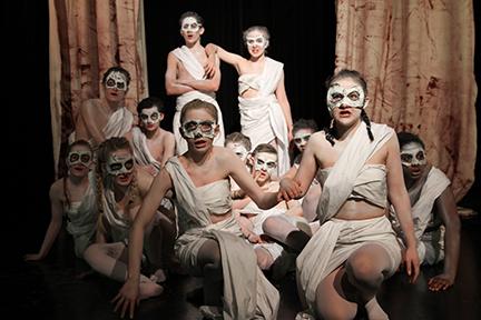 The cast of Antigone performs a dress rehearsal Oct. 12. Actors were sprayed with white makeup for the production. 