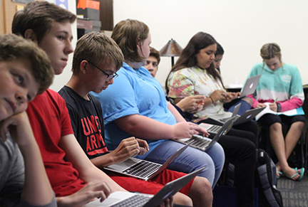 ASL students use laptops for class projects.