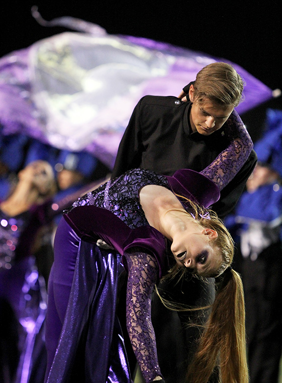 At the football game against Plano West, juniors Ali Lenhard and Eric Boatman perform during the halftime show.