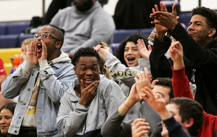 During the Boys Varsity basketball game against Plano East, senior Austyne Chetwood and junior Cordrick Dunn react to a three point play.