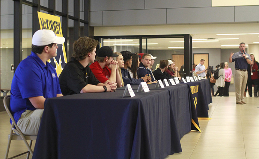 On national signing day, Athletic Director and Football Head Coach Jeff Smith introduces the college signees during the ceremony. This senior class has had more signees than any year prior.