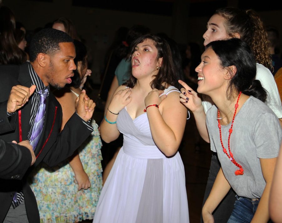 Isabel Flores dances with her friends while at the Jolly Jive dance.