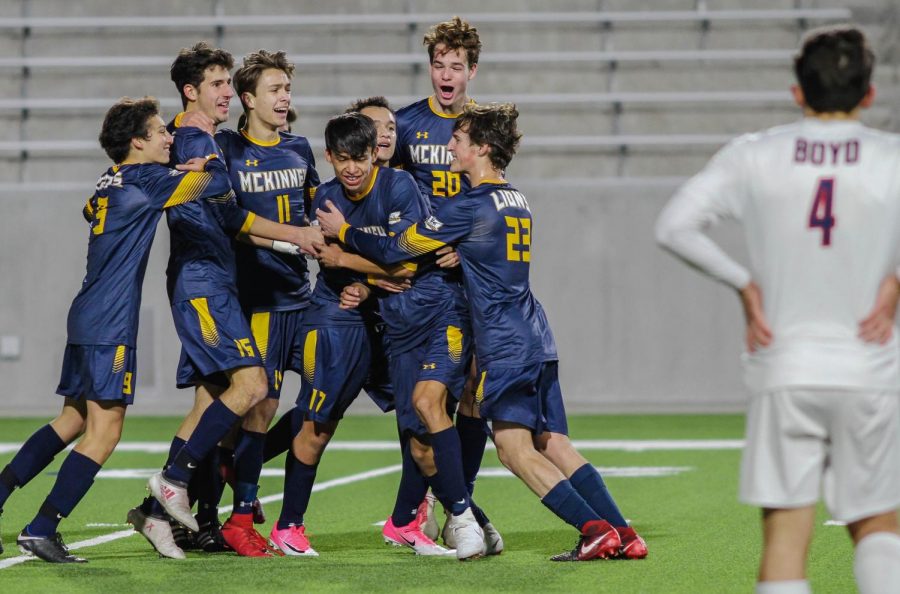The Varsity boys soccer team celebrates the winning goal made by Emmanuel Martinez at the game against Boyd Tuesday night.