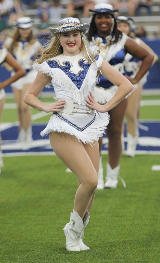 Kayla Clark performs during halftime in a football game against Prosper.