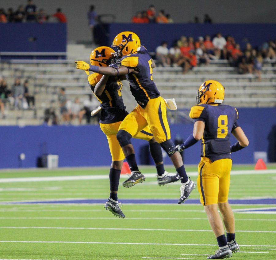 McKinney Lions celebrate after making a touchdown. 