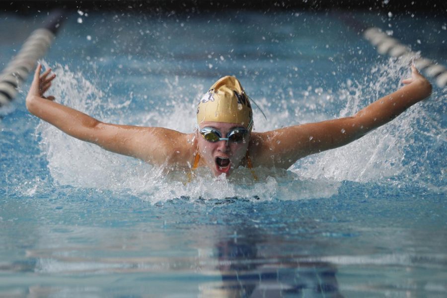 Kaylee Lewis swims butterfly in the first meet of the season against Denison, McKinney North, and Boyd.