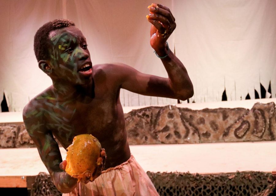 Tristan Rotich eats a mango as part of a scene during the dress rehearsal for The Tempest. The show runs Thursday, Friday and Saturday at 7 p.m.